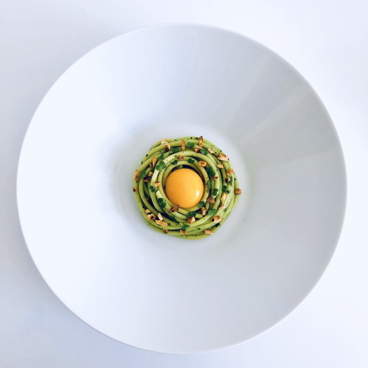 Bucatini with deconstructed pesto, mint & confit egg yolk