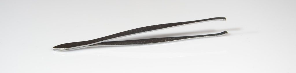 A picture of tweezers on a white background